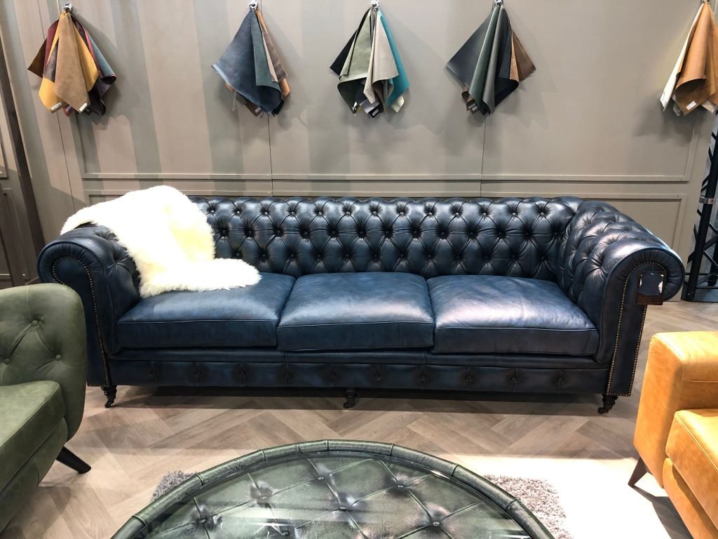 Antique blue leather Chesterfield sofa for a boutique hotel interior